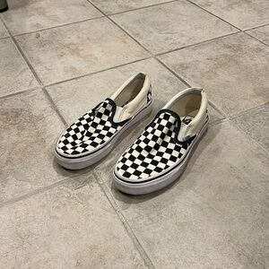 Checkered cream and black slip on vans
